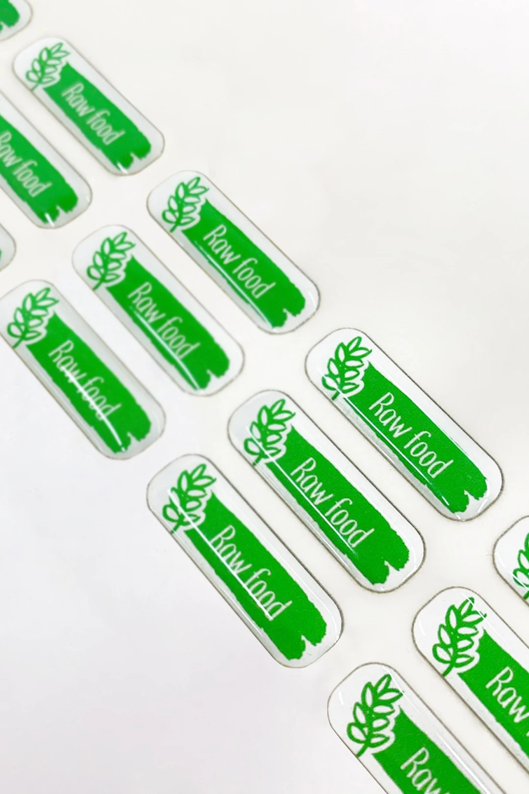 Купить наклейку заливную 3х1 см, с нанесением "Raw food" Купить наклейку заливную 3х1 см, с нанесением "Raw food"
